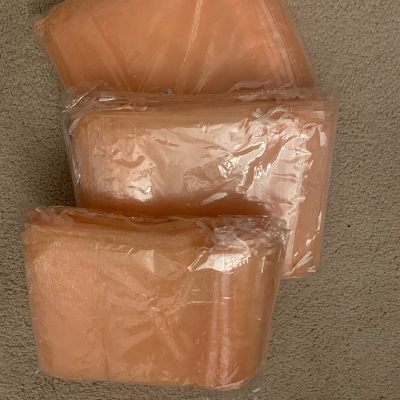 Light peach 5x7 organza bags. Says champagne color - it’s a light peach. - Picture 2 of 5
